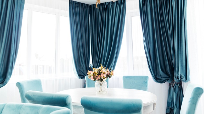 blue velvet curtains in dining room