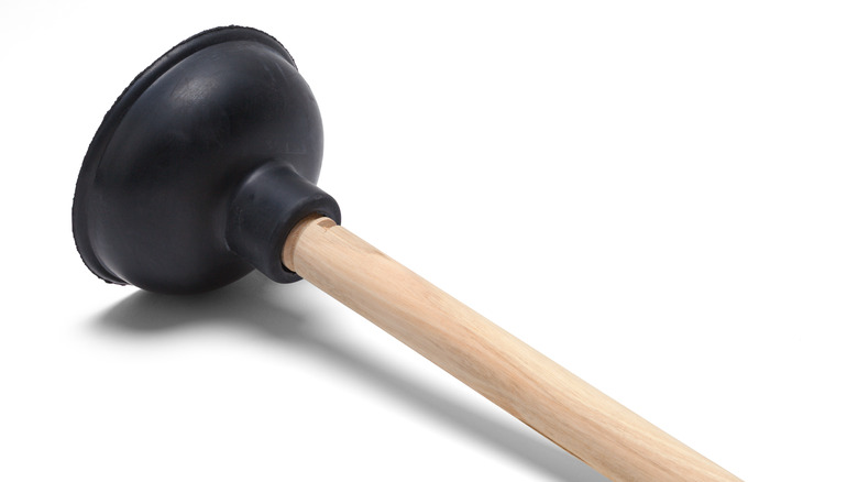 black plunger with wood handle