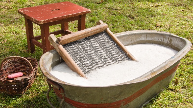 Doing laundry with washboard