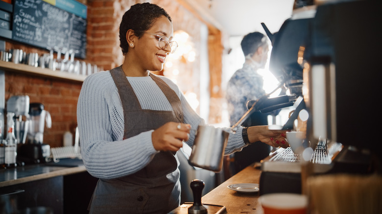 woman at coffee maker