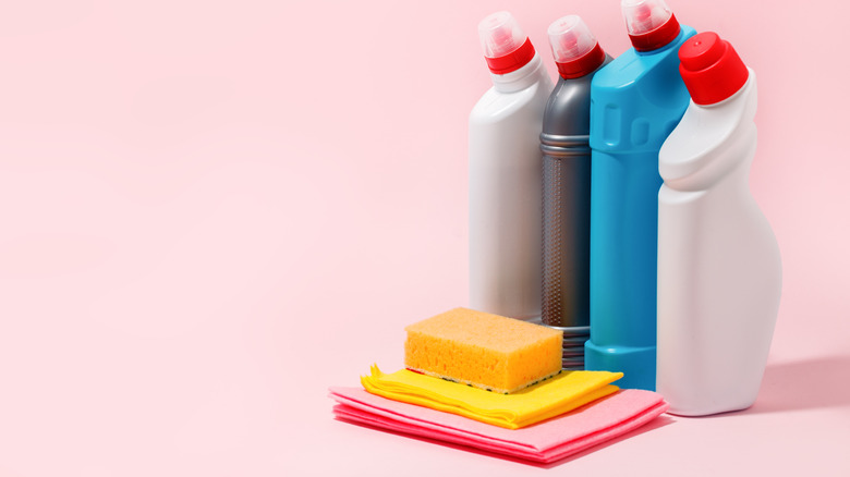 Cleaning products on pink background