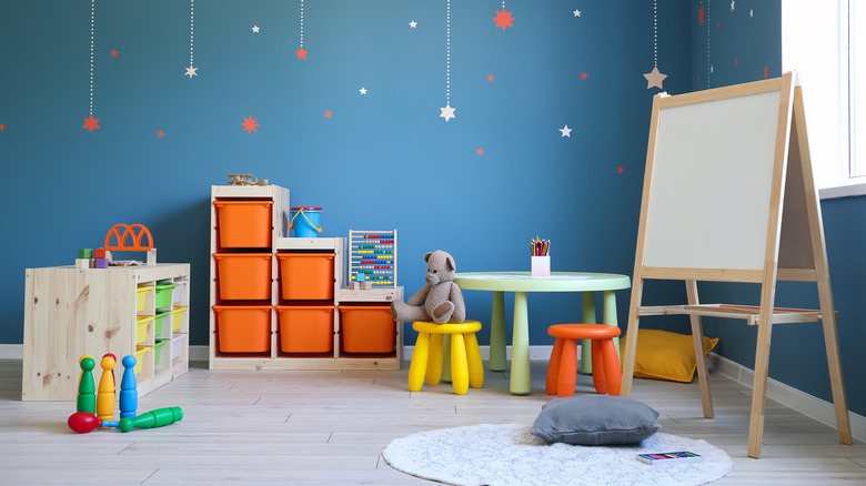 Playroom with easel and toys