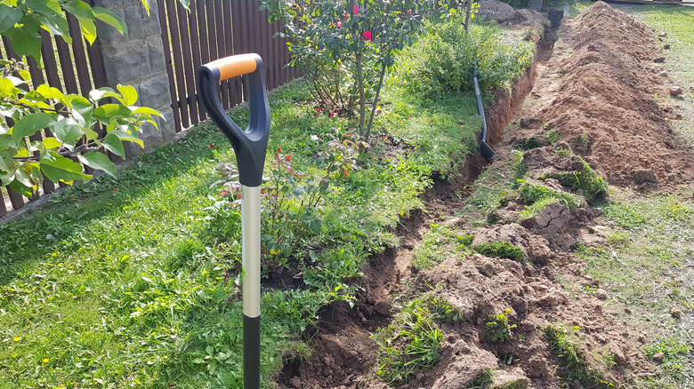 trench with garden spade