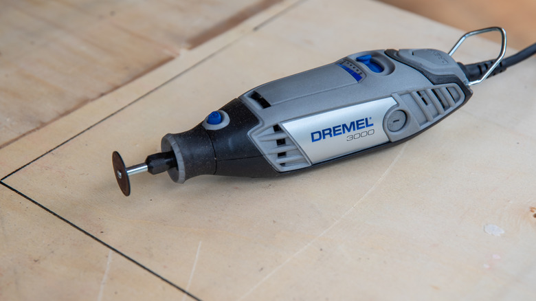 Dremel tool on wooden background