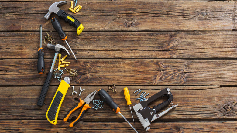 Tools on wooden background