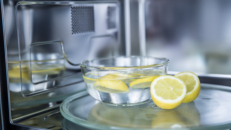 Bowl of lemon water in microwave