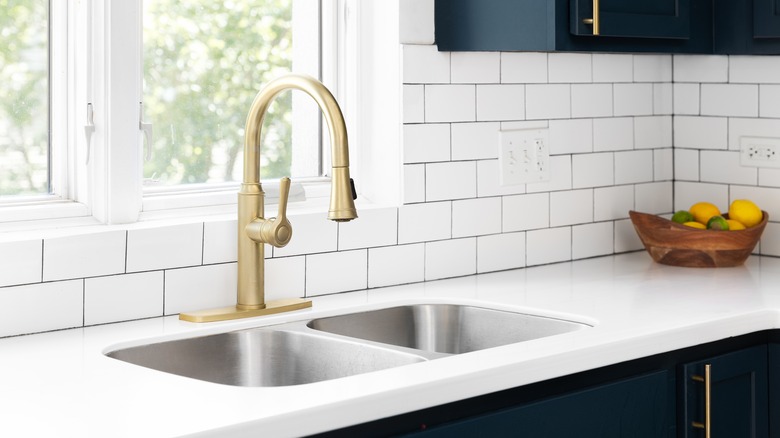 kitchen sink with backsplash tiles