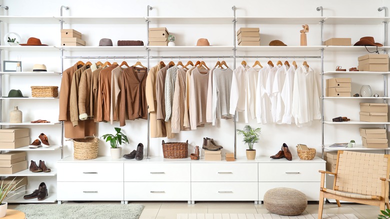 open closet system with shelves and rack