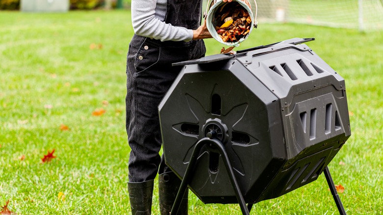 adding compost to elevated bin