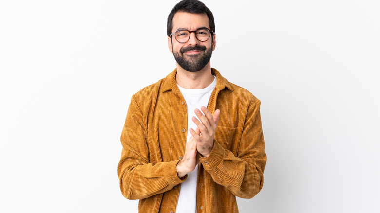 man wearing yellow corduroy jacket