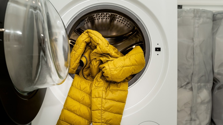 yellow puffer coat in washing machine