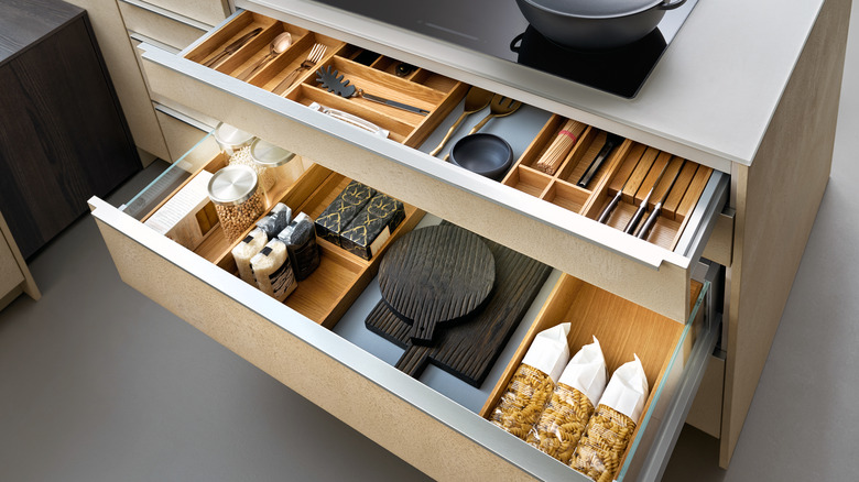 open drawers with kitchen equipment