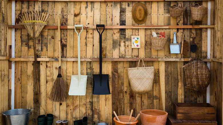 Garden tools hanging on wall