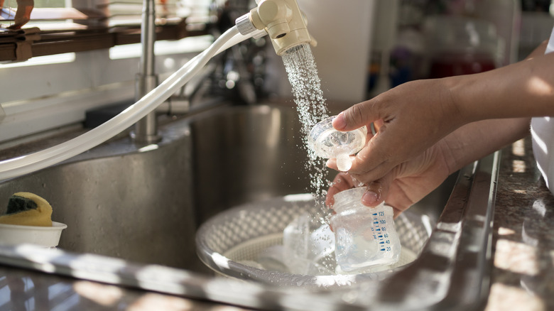 baby bottle in kitchen sink