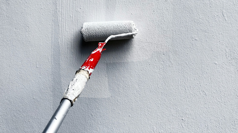 painting a ceiling with a roller