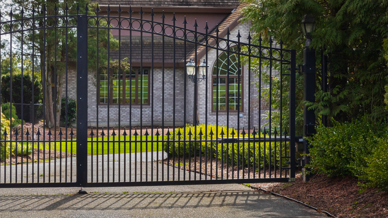 home with black wrought iron fence