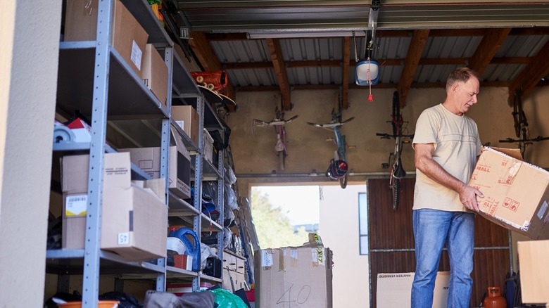 Man cleaning out garage/boxes