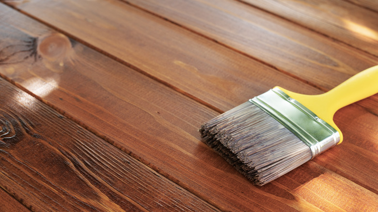 Stained deck and brush