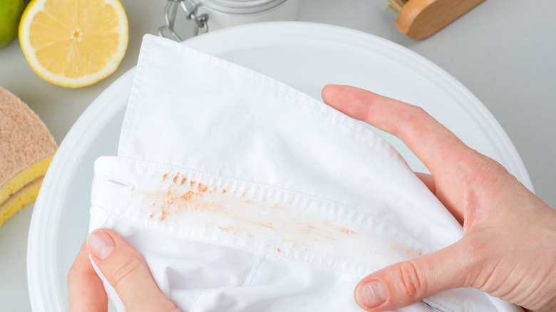 Treating orange stain with lemon juice