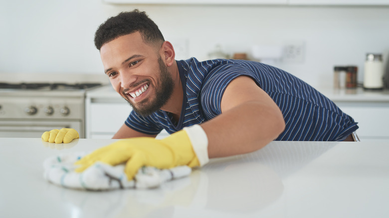 Man cleaning countertops