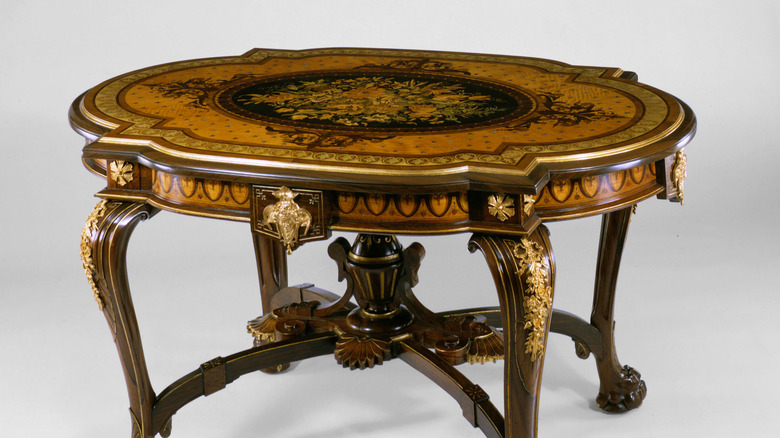 Antique table decorated with marquetry