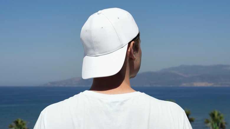 Man wearing white cap