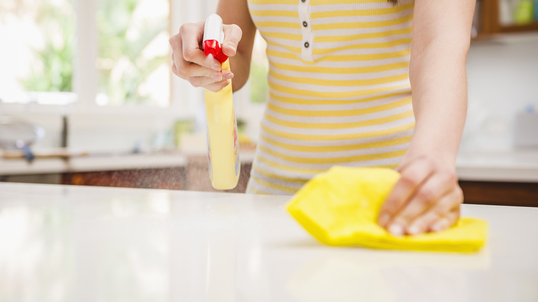 Woman wiping counter with Swedish dishcloth