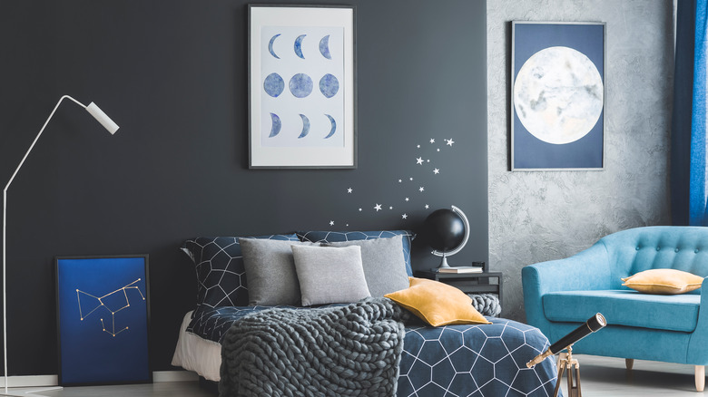 Celestial posters in bedroom 