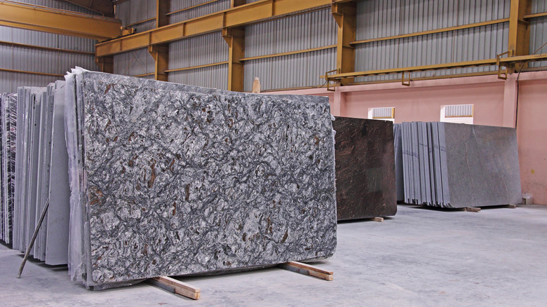 slabs of granite standing up in warehouse