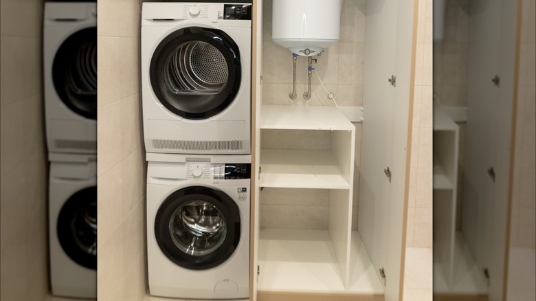 Stacked washer and dryer in a laundry closet