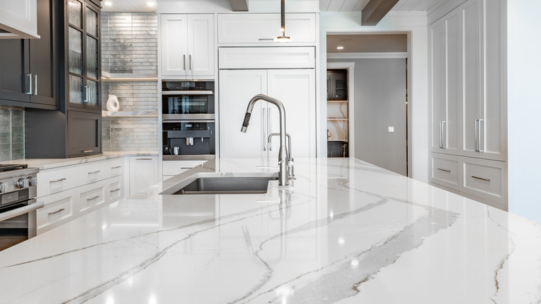 white kitchen counter and sink