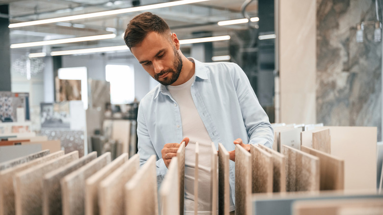 A person looking at tile options