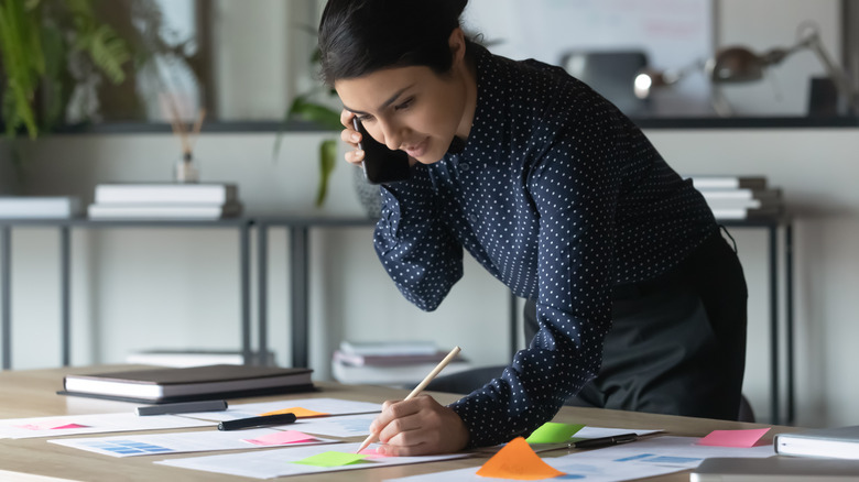 woman using sticky notes