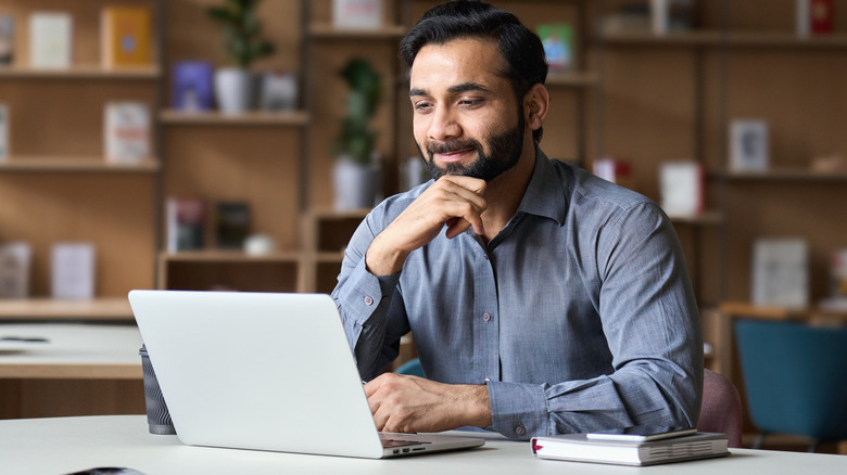 man working at computer