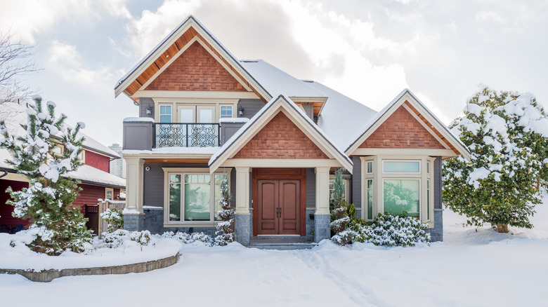 suburban house covered in snow