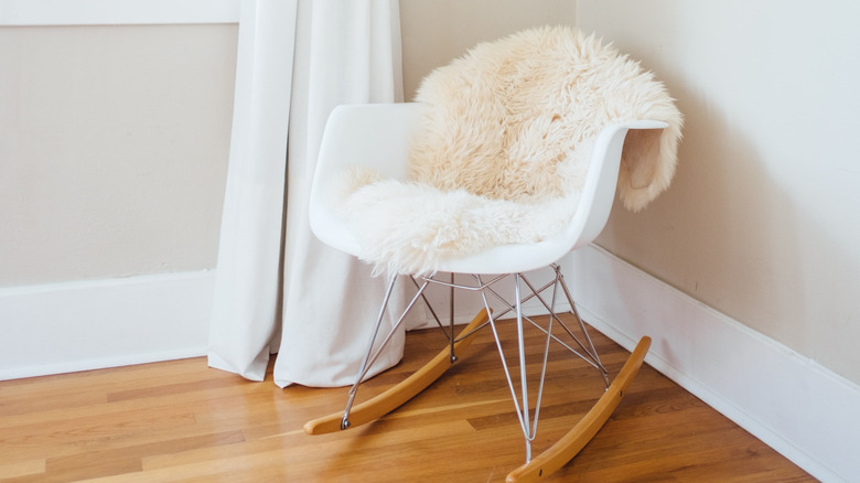 fur blanket on white chair 