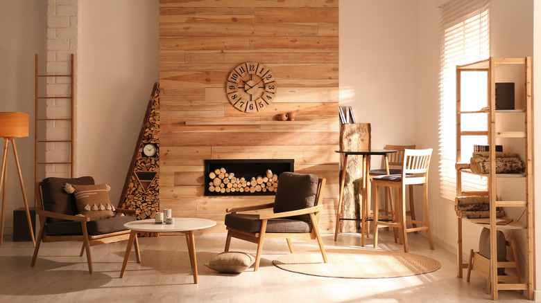 wooden fireplace surrounded by wooden furniture