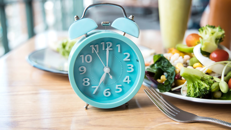 Turquoise clock on kitchen table 