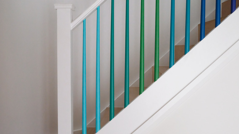 Turquoise, green, and blue stair rails 