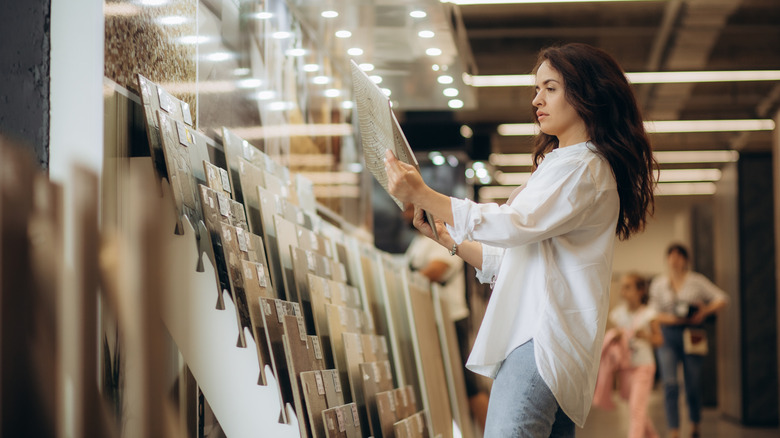 Woman shopping for tile in a store