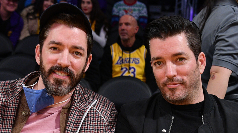 Drew and Jonathan Scott in center frame