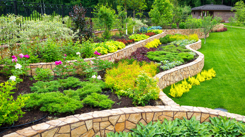 beautiful garden bed with retaining wall