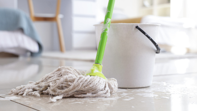 Tile flooring with mop and bucket