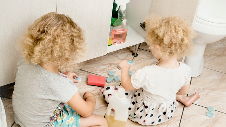 girls play with bathroom chemicals