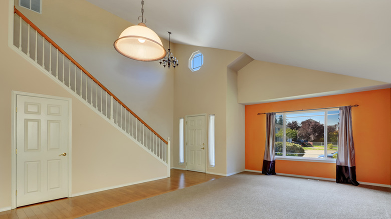 Room with orange accent wall