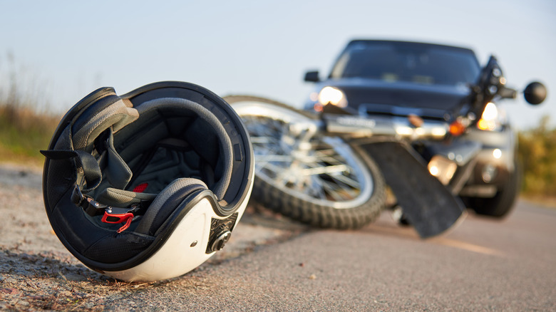 helmet laying in road after crash