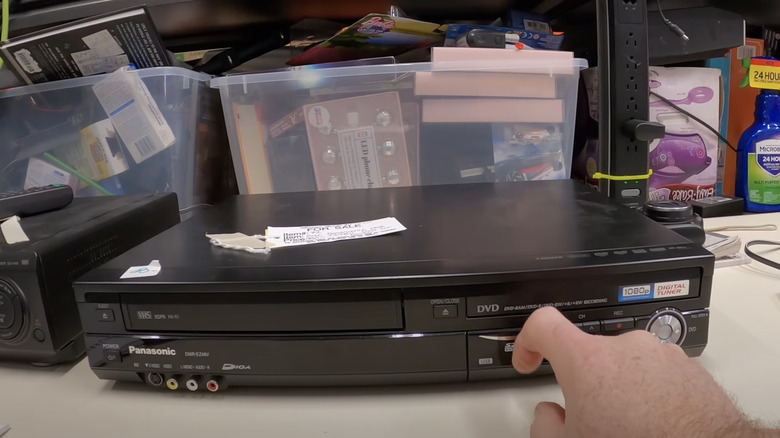 testing dvd player at estate sale