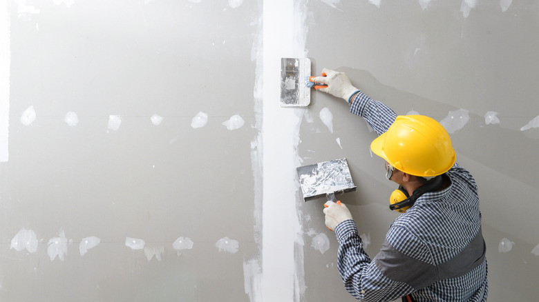 Painting contractor wearing hard hat