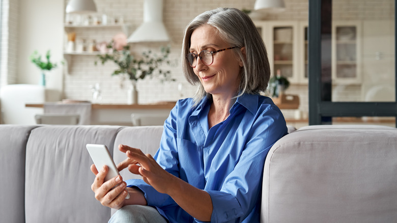 Woman using phone.