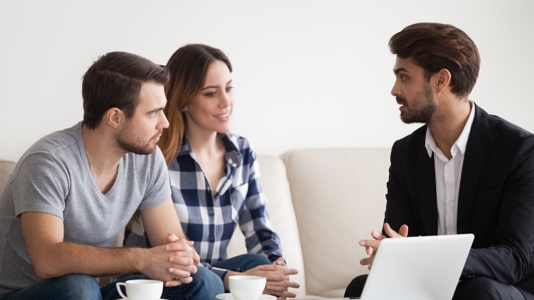 Couple consulting with interior decorator